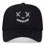 Casquette trucker avec patch brodé à visage souriant