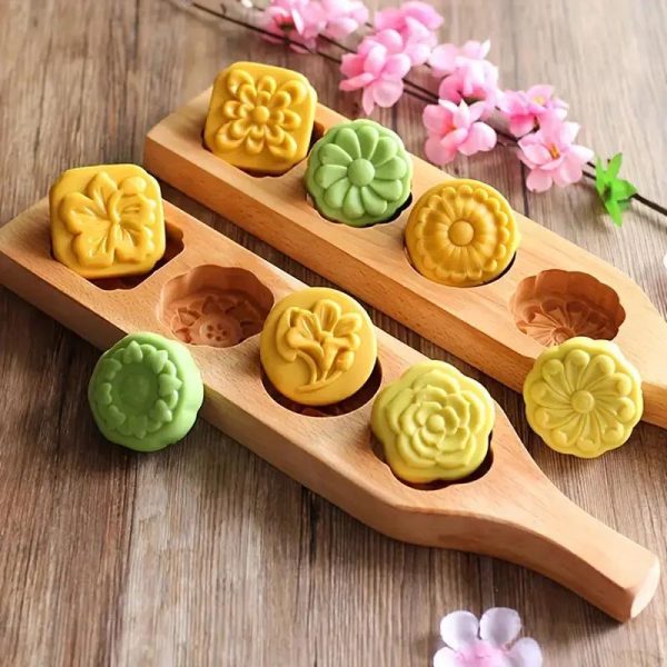Moule nerikiri en bois avec motifs floraux et géomètriques