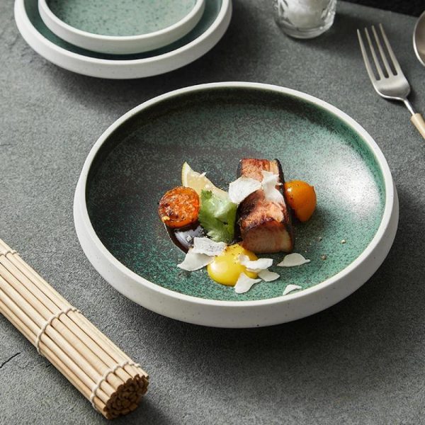 Assiette en céramique émaillée à effet moucheté