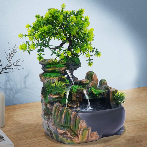 Fontaine à eau d'intérieur zen avec bonsaï artificiel et cascade rocheuse