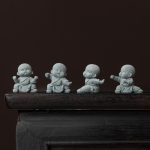 Set de 4 figurines de moines bouddhistes pour décoration zen