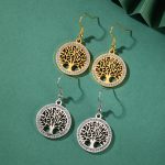 Boucles acier inoxydable pendantes ornées d'un arbre de vie ajouré serti de strass