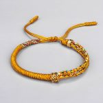 Bracelet-coulissant-cordon-tresse-artisanal-avec-perle-en-cuivre-dore-grave-picture-3