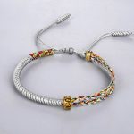Bracelet-coulissant-cordon-tresse-artisanal-avec-perle-en-cuivre-dore-grave-picture-6