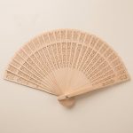 Eventail-japonais-traditionnel-en-bois-de-santal-aux-decoupes-florales-et-geomet-picture-1-1