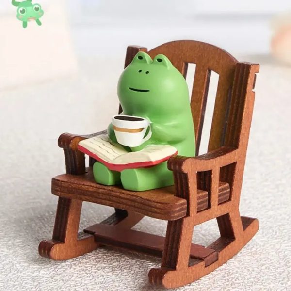 Figurine de grenouille en résine dans un fauteuil à bascule miniature
