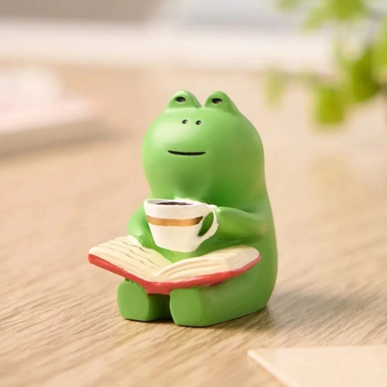 Figurine de grenouille en résine dans un fauteuil à bascule miniature