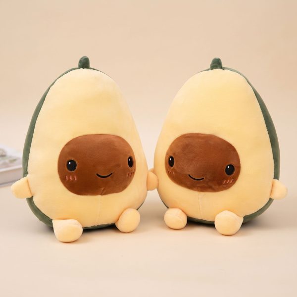 Peluche avocat kawaii moelleuse en forme de fruit coupé avec noyau souriant
