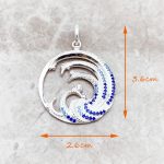 Pendentif rond zircone bleue en argent 925 à motif de vague