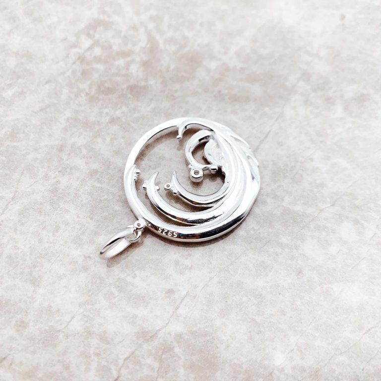 Pendentif rond zircone bleue en argent 925 à motif de vague