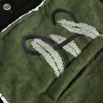 Veste-sherpa-noir-et-vert-kaki-a-broderies-florales-dorees-et-passepoil-blanc-mo-picture-6