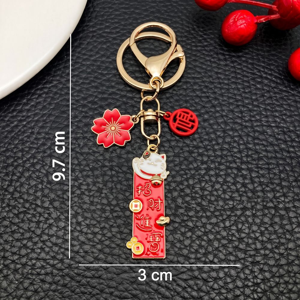 Porte-cles-porte-bonheur-japonais-emaille-a-charms-maneki-neko-technique-2468